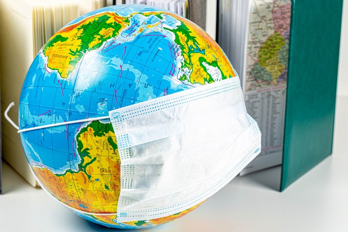 Globe with Face Mask and Books