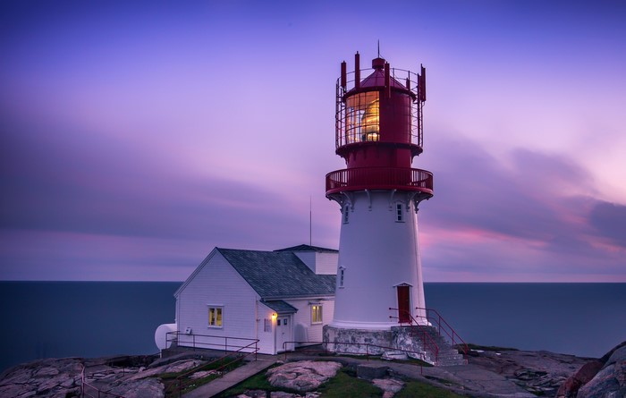 Lighthouse on the coast of Norway at dusk