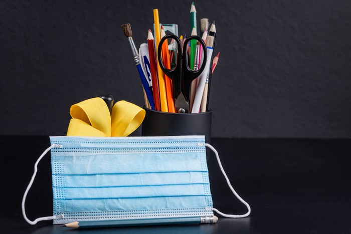 Face mask with art supplies and pencil
