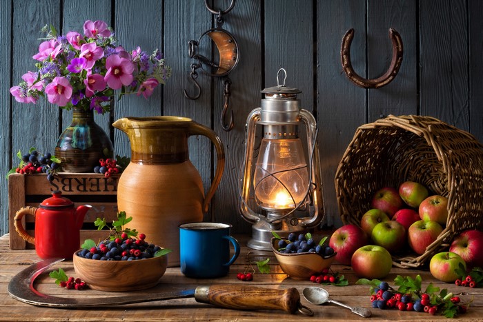 Still-life with apples, berries, flowers, and kerosene lamp