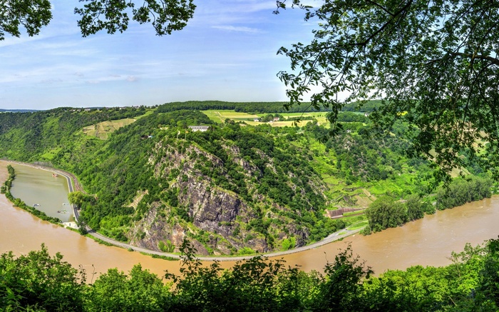 River valley with steep, forested hills and a winding river