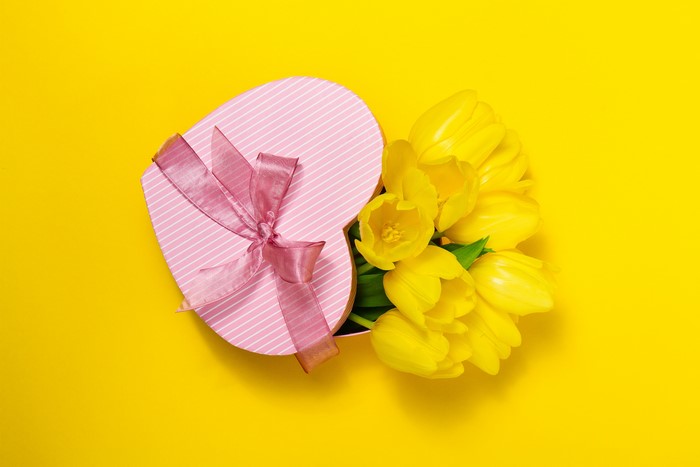 Heart-shaped gift box with yellow tulips