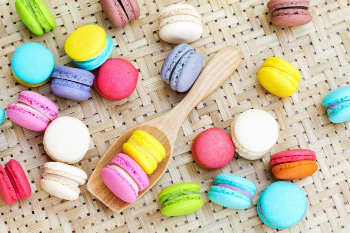 Multicolor Macarons on a Woven Mat