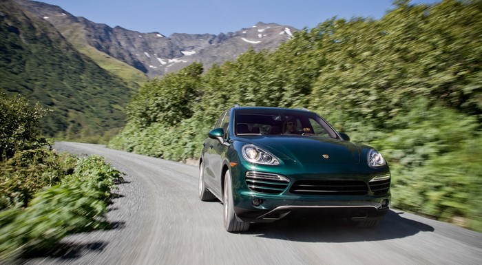 Green Porsche Cayenne Diesel on a Mountain Road