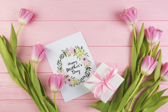 Pink Tulips and Mother's Day Card on Pink Wood