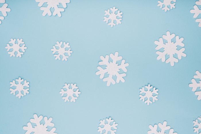 White snowflakes on a blue background