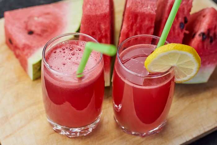 Watermelon juice with lemon slices and straws