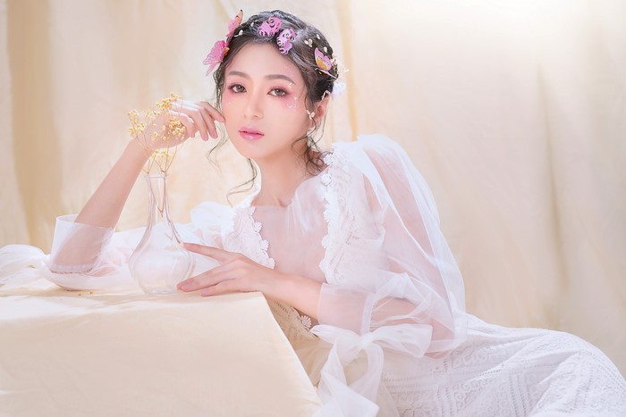 4K Asian Woman Sitting with Butterflies