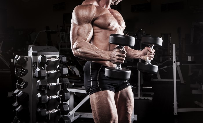 Man with dumbbells in a gym