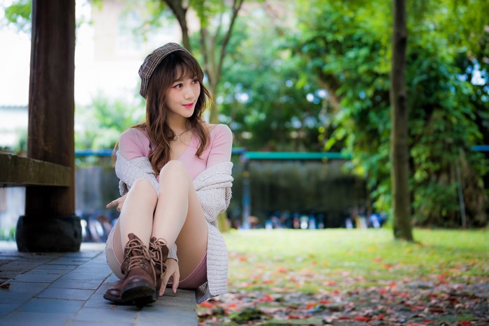 4K Asian Woman Sitting in Park with Beret
