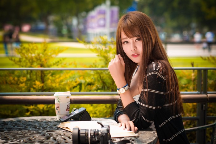 4K Asian Woman Sitting with Watch and Book