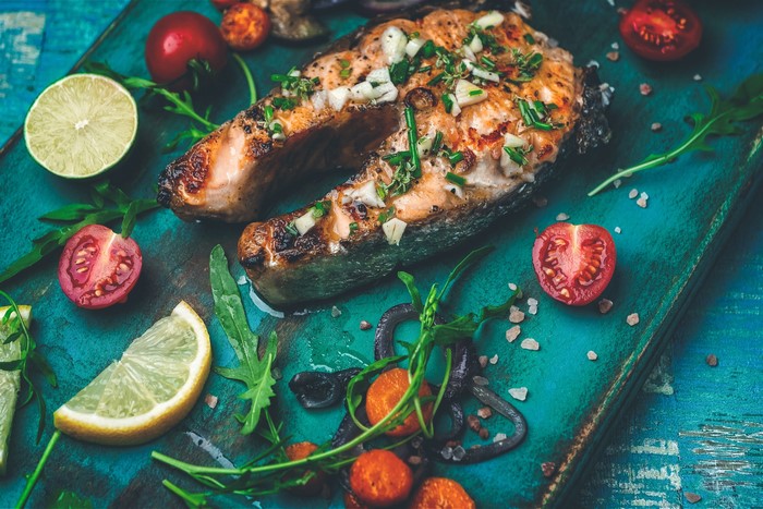 Grilled Salmon Steak with Cherry Tomatoes and Lemon