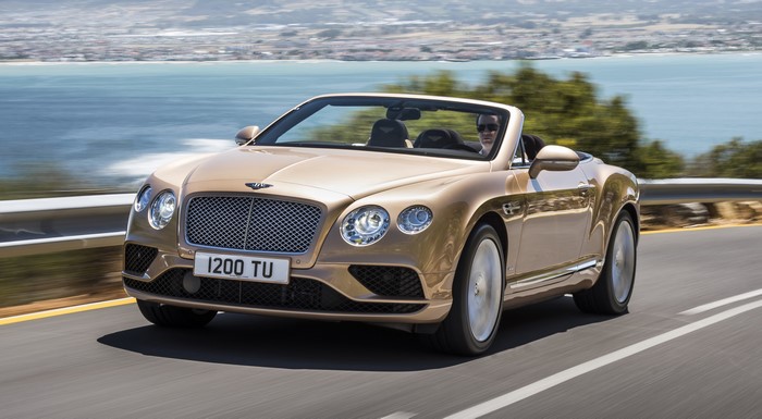Bentley Continental GT Convertible driving on a coastal road