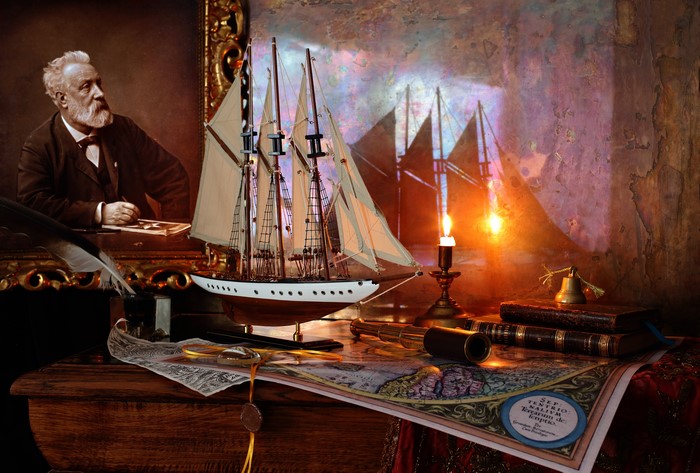 Jules Verne's desk with ship model, map, and books