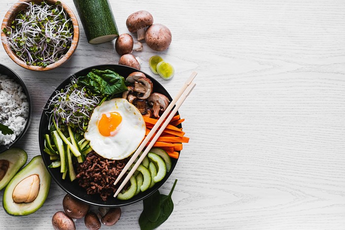 Bibimbap with fried egg, mushrooms, and vegetables