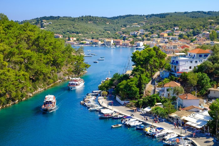 Boats in a bay with a town on the hills