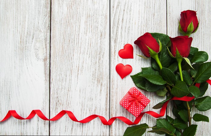 Red Roses, Hearts, Gift, and Ribbon on Wood