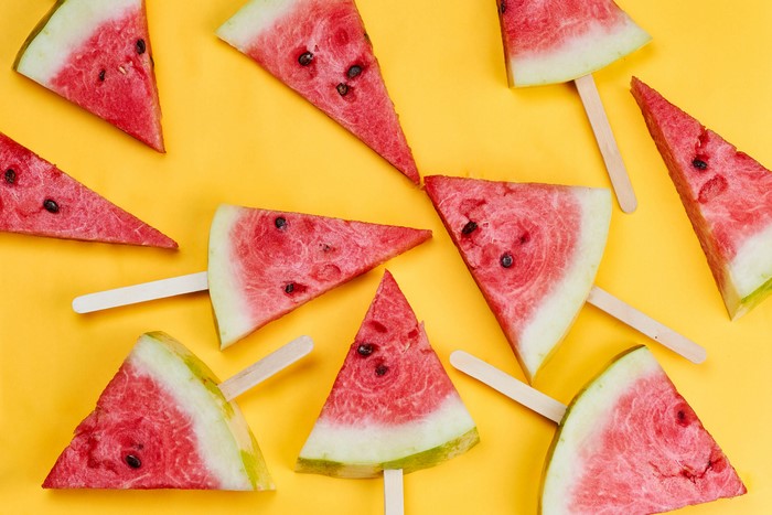 Watermelon slices on a yellow background