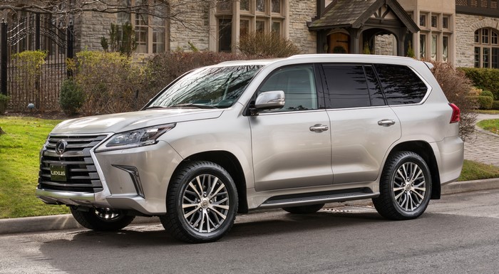 Silver Lexus LX 570 SUV parked on a street