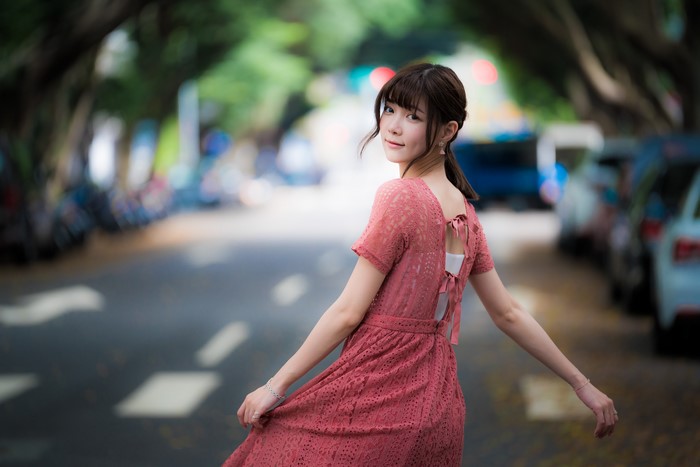 Asian woman with brown hair in a dress