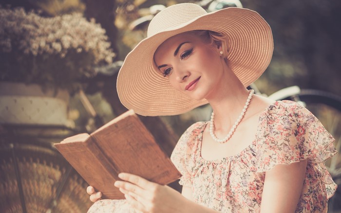 Woman in Hat Reading a Book
