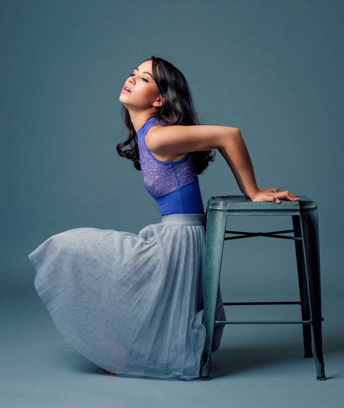 Maya sitting on a stool