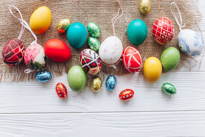 Easter Eggs on Burlap and White Wood Surface