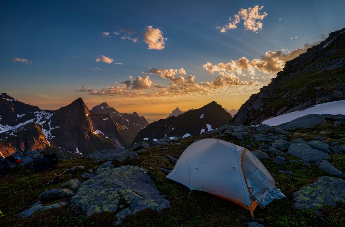 Tent in Lofoten Mountains at Sunset