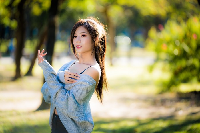 4K Image of Asian Woman in Sweater with Bokeh