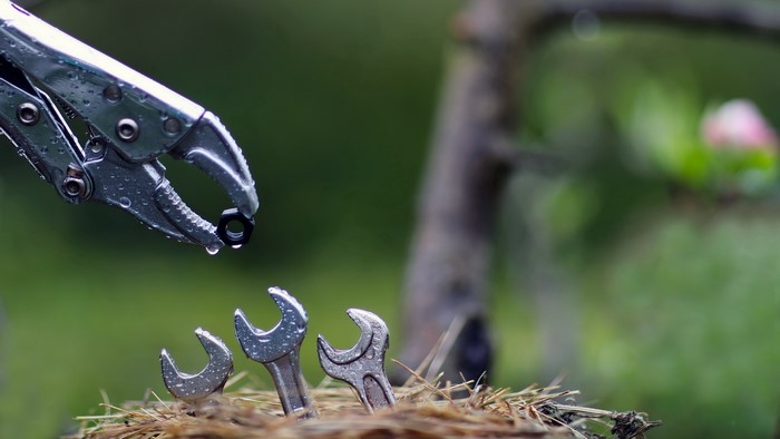 Wrenches and nut in a nest with bokeh background