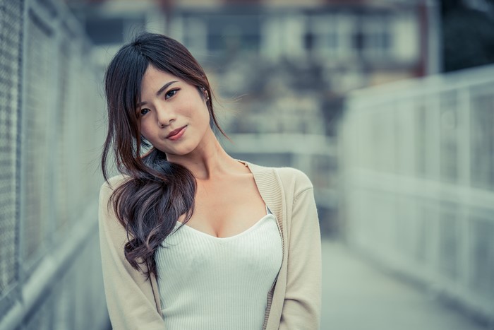 Brunette girl with cardigan and white top