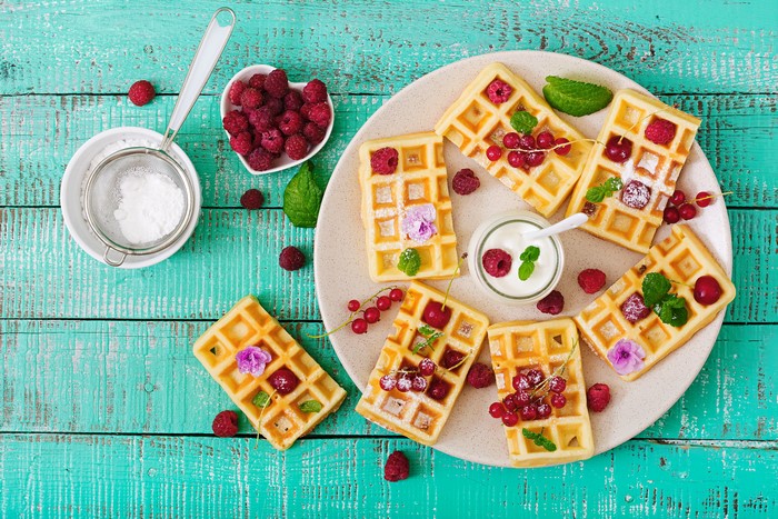 Waffles with Raspberries and Powdered Sugar on a Plate