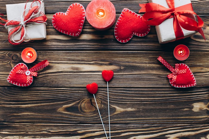 Valentine's Day Gifts, Candles, and Hearts on Wood