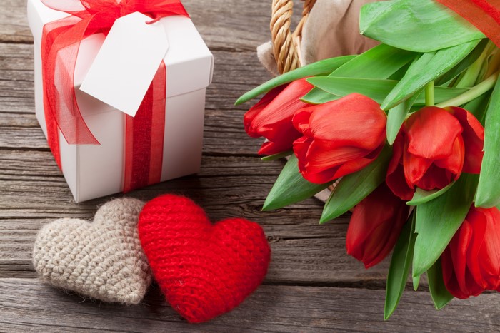 Valentine's Day gift with red tulips and hearts