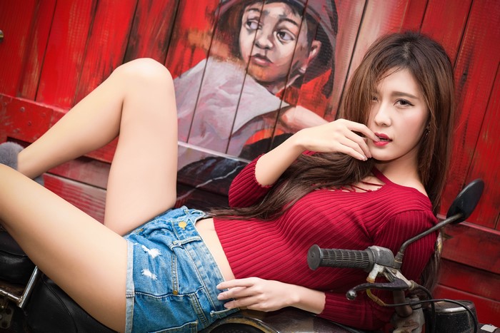 Asian Woman in Red Sweater and Denim Shorts