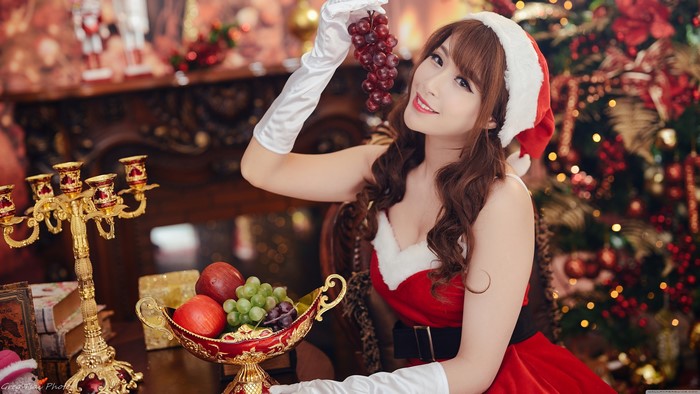 4K Christmas Joy with Asian Woman in Santa Outfit