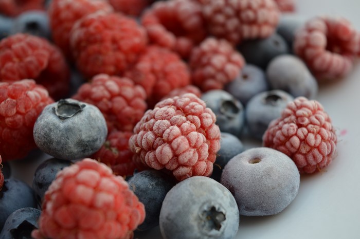 Close-up of frozen raspberries and blueberries