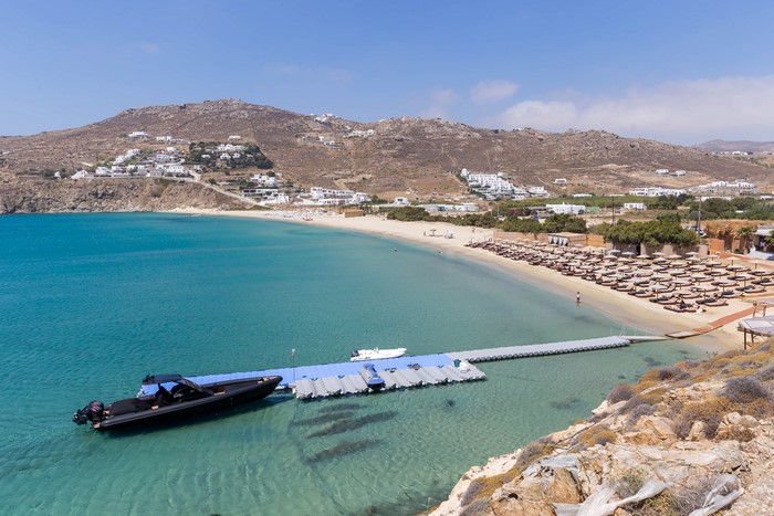 Motorboat docked at a floating pier in Kalo Livadi, Mykonos, Greece
