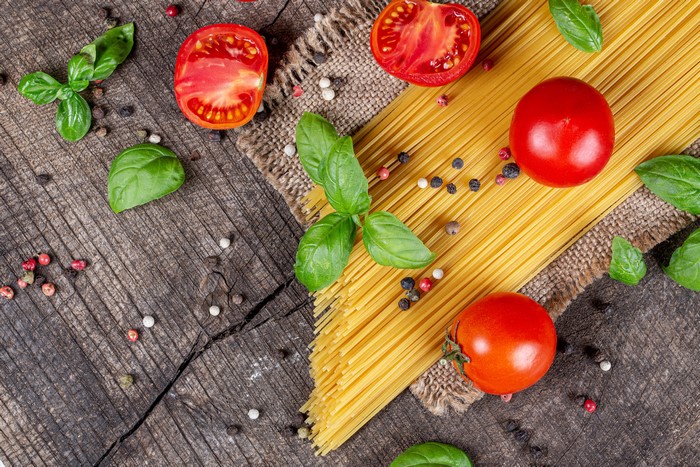 Spaghetti with Tomatoes and Basil on Wood
