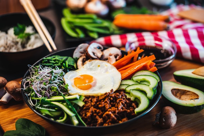 Bibimbap with fried egg, mushrooms, and vegetables