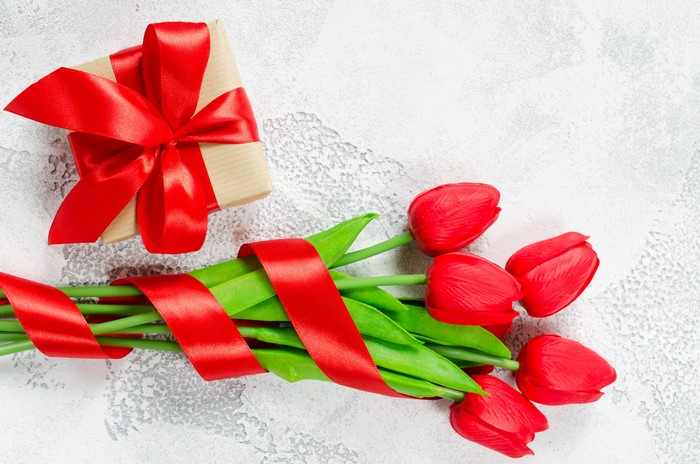 Gift and Red Tulips with Red Ribbon