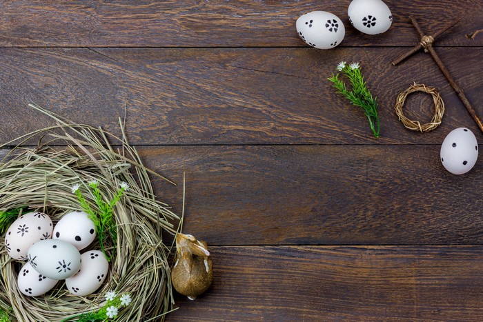 Easter eggs in a nest on wood planks