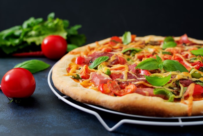 Pizza with Ham, Tomatoes, and Basil