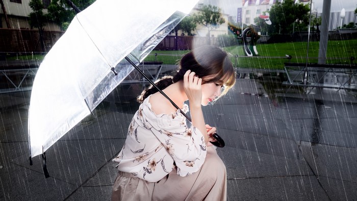 Woman with Umbrella in the Rain