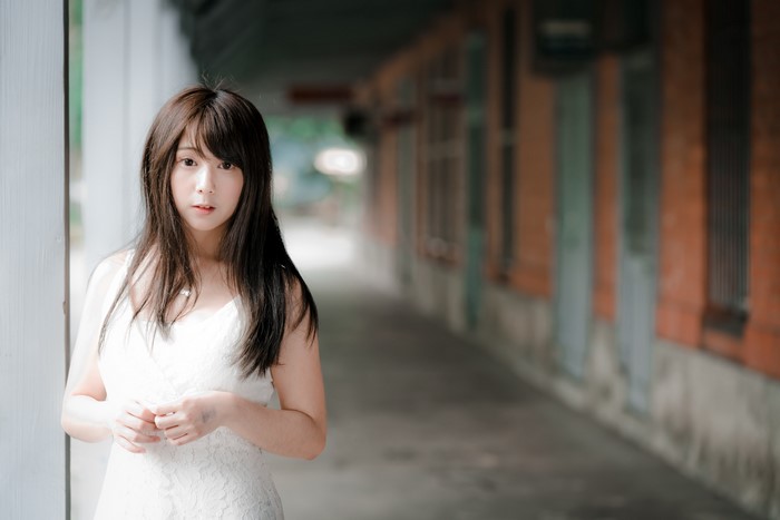 Brunette girl in white dress