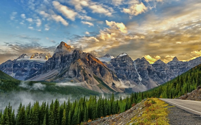 Mountain range with pine forest and road