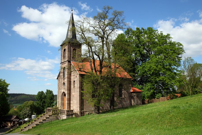 Ev. Kirche Bornhagen, Germany with trees and sky