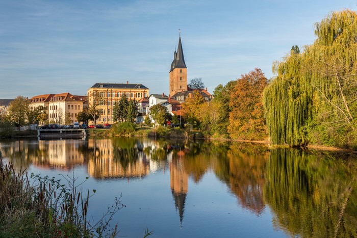 Altenburg Germany Riverfront with Church Tower and Autumn Trees