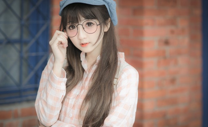 Asian girl with glasses and brown hair
