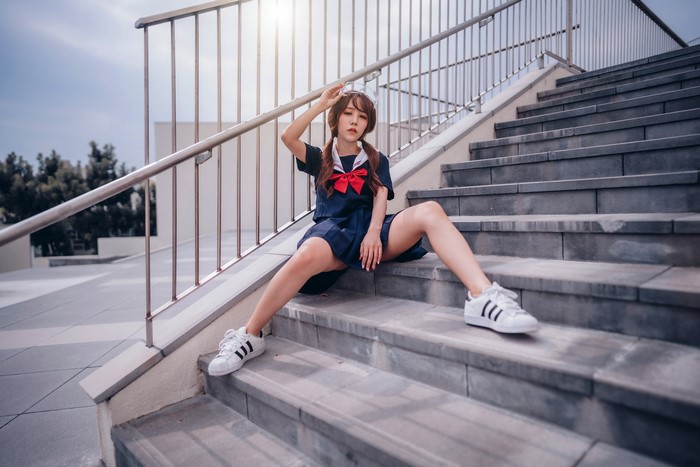 4K Asian Schoolgirl Sitting on Stairs